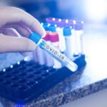 Covid 19 written on test tube