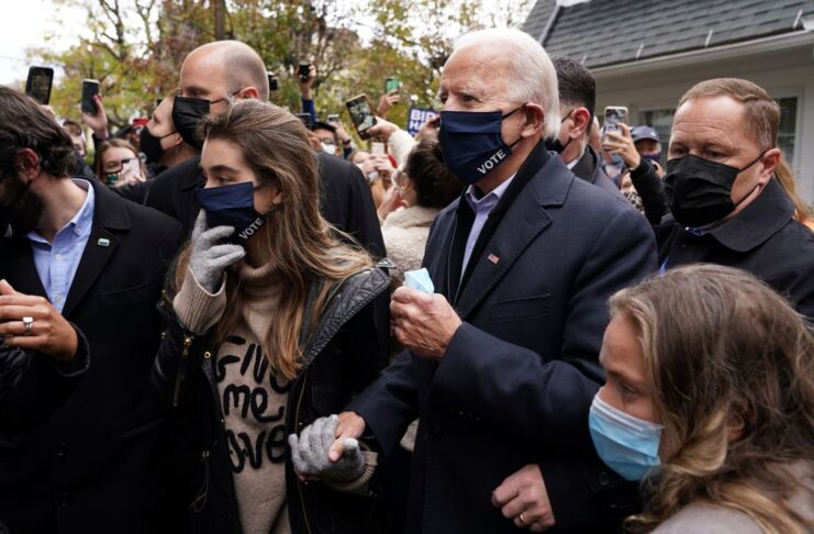 U.S. Democratic presidential nominee Joe Biden makes his way through the crowd outside of his childhood home on Election Day in Scranton, Pennsylvania, U.S. November 3, 2020. REUTERS/Kevin Lamarque