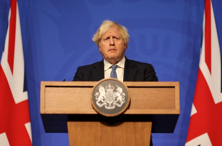 British Prime Minister Boris Johnson holds a news conference for the latest coronavirus disease (COVID-19) update in the Downing Street briefing room, in London, Britain December 8, 2021. Adrian Dennis/Pool via REUTERS