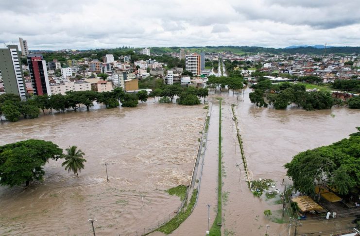 An aerial view shows a neighbourhood during flooding caused by the overflowing Cachoeira river in Itabuna, Bahia state, Brazil, December 26, 2021. Picture taken with a drone. REUTERS/Leonardo Benassatto  NO RESALES. NO ARCHIVES