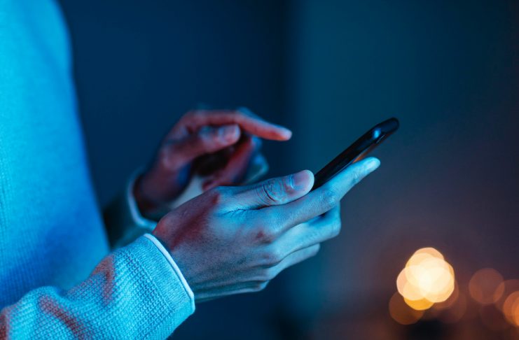 side-view-of-man-using-smartphone-1