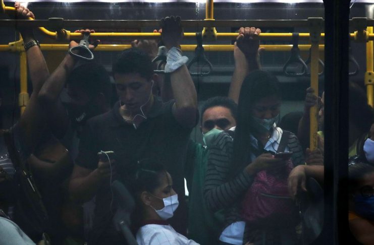 Passengers travel on a public bus amid the coronavirus disease (COVID-19) pandemic, in Rio de Janeiro, Brazil, November 18, 2020. Picture taken November 18, 2020. REUTERS/Ricardo Moraes